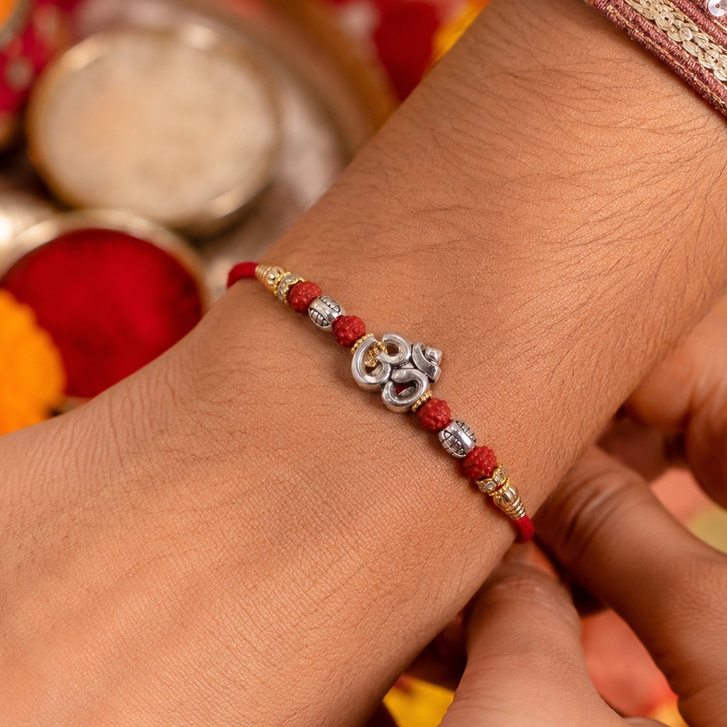 Elegant Om Rudraksha Rakhi displayed from a different angle, highlighting intricate design.