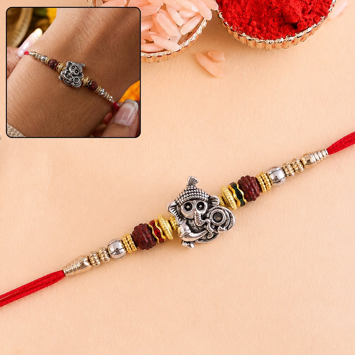 Antique silver Baby Ganesha Rakhi with Rudraksha bead, traditional festive design