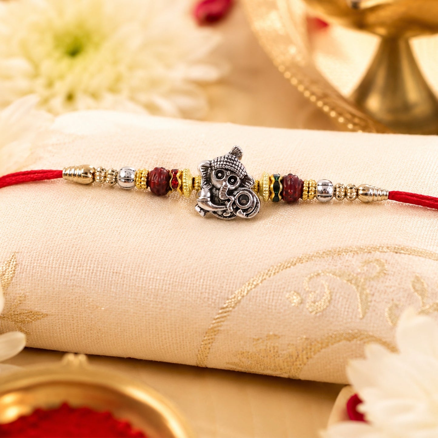 Elegant antique silver Rakhi with Baby Ganesha motif, perfect for Raksha Bandhan