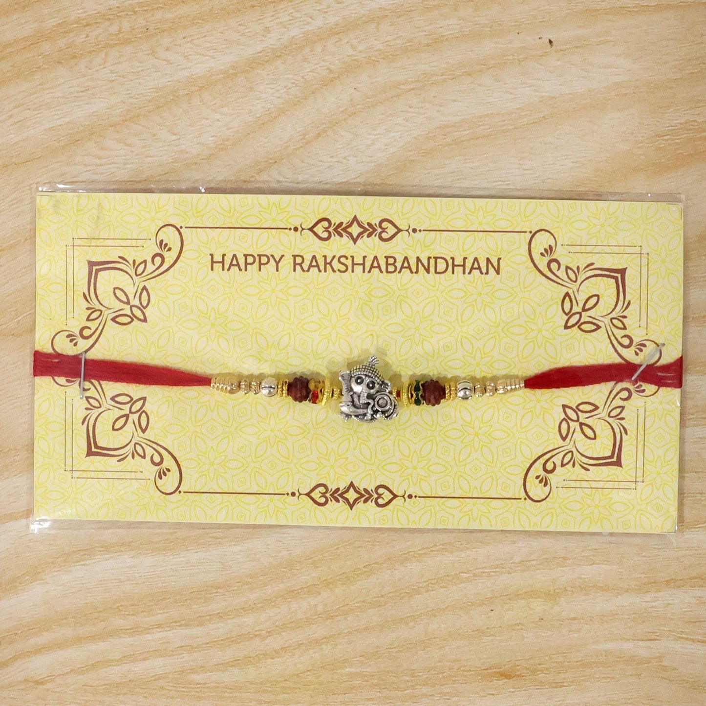Beautiful antique silver Baby Ganesha Rakhi, lightweight and easy to tie