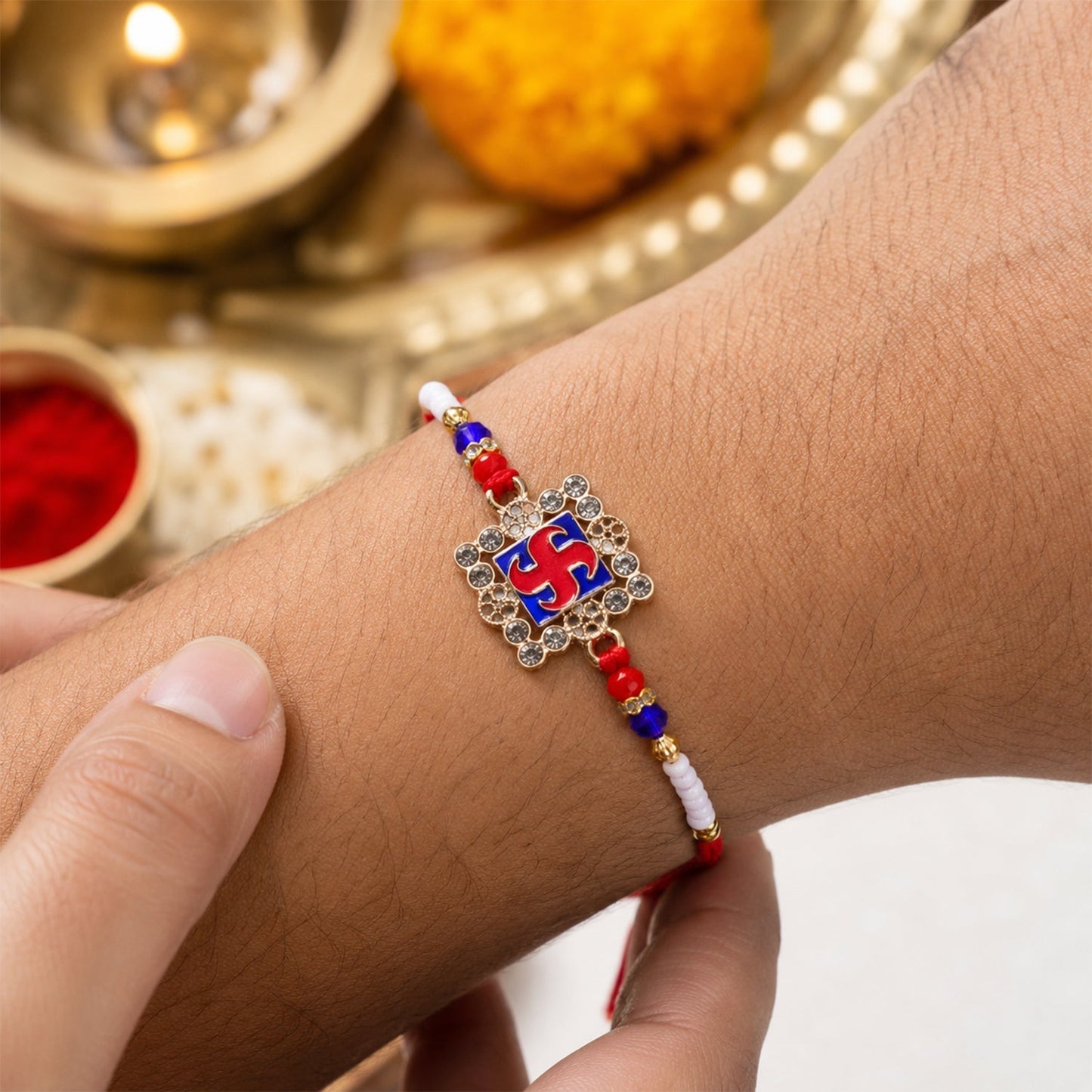 Elegant designer Rakhi with meenakari work and crystal beads for brother