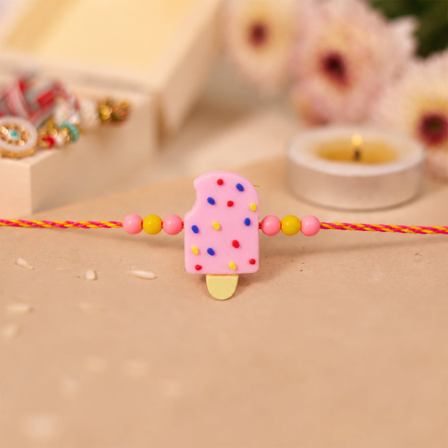 Full view of the Ice Cream Kids Rakhi showcasing its colorful design.
