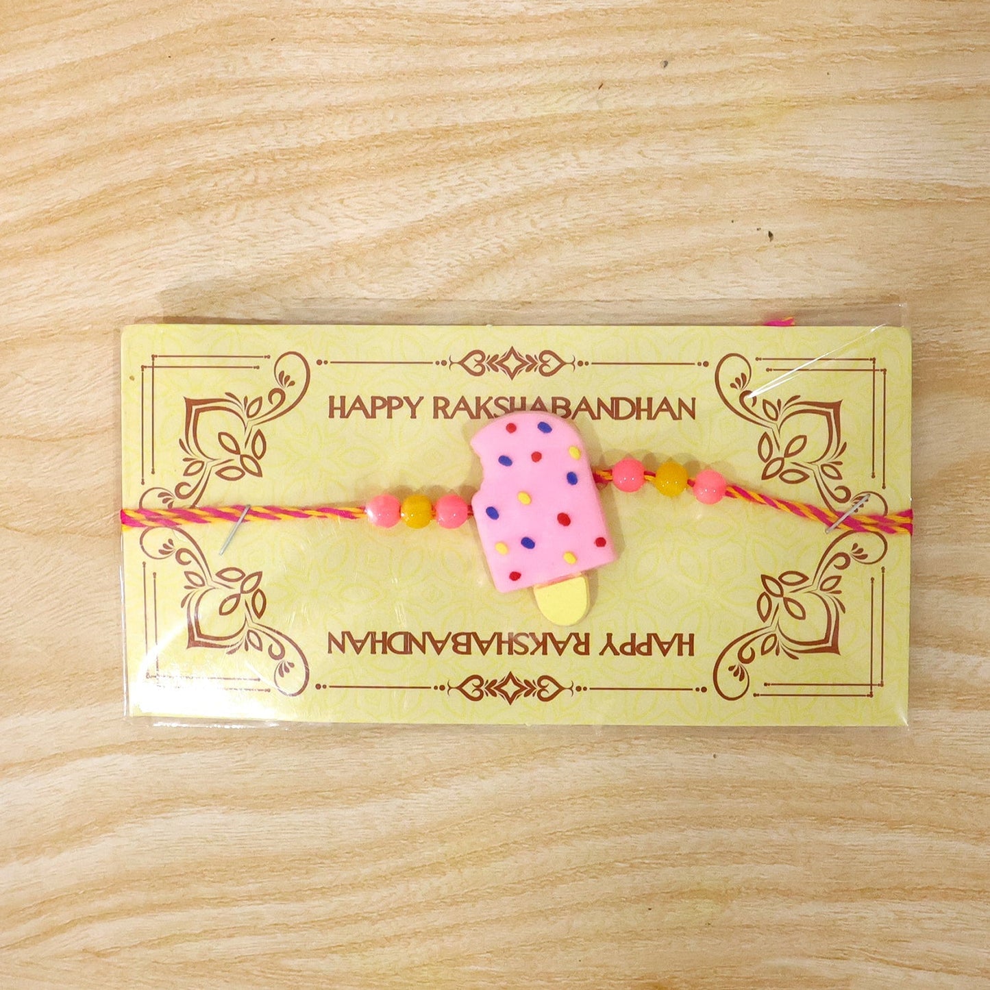 Different angle of the cute Ice Cream Kids Rakhi, perfect for Raksha Bandhan.