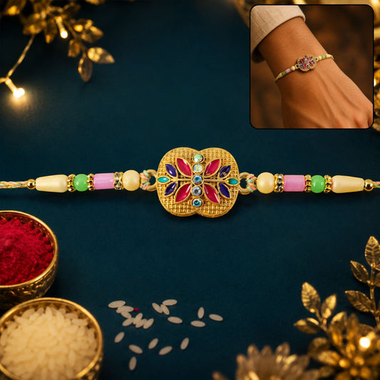 Golden meenakari floral rakhi with AD stones, pearls, and vibrant design