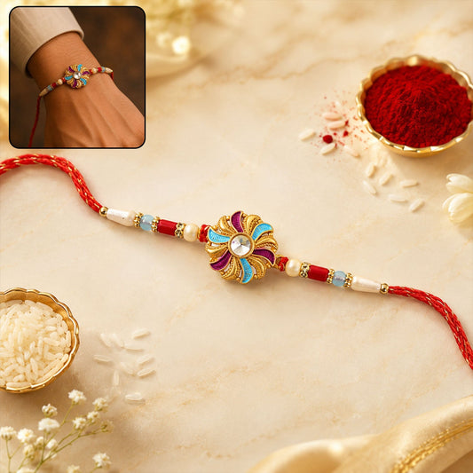 Golden Meenakari Pinwheel Rakhi featuring enamel and diamond accents