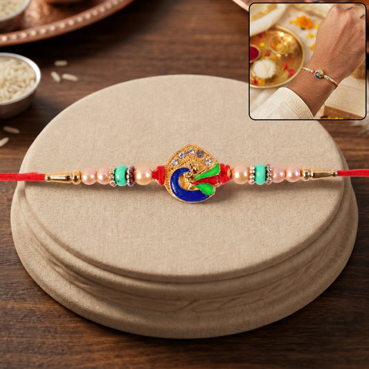 Golden meenakari peacock Rakhi with pearl and turquoise beads for brothers