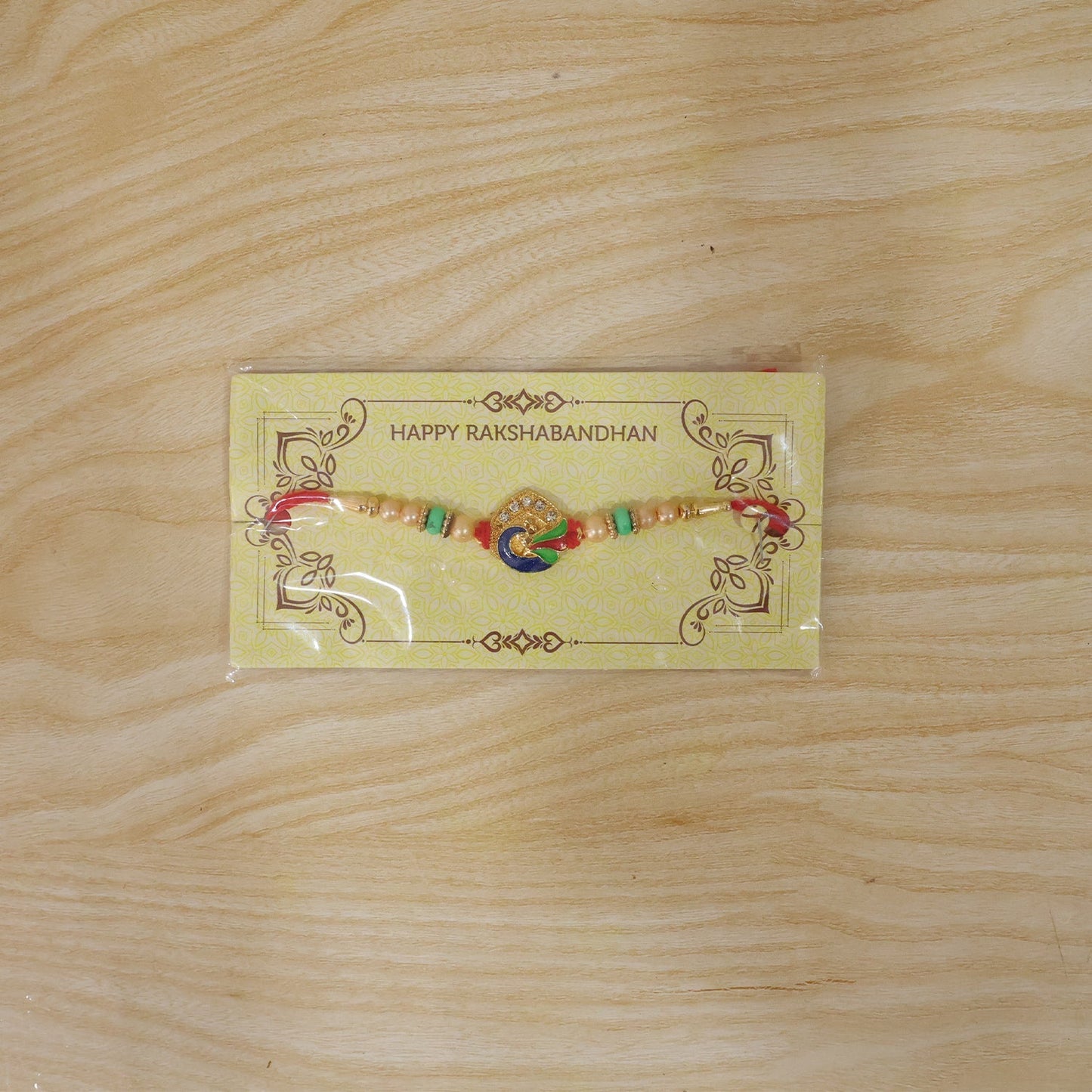 Stylish meenakari peacock Rakhi for sibling gifting during Raksha Bandhan