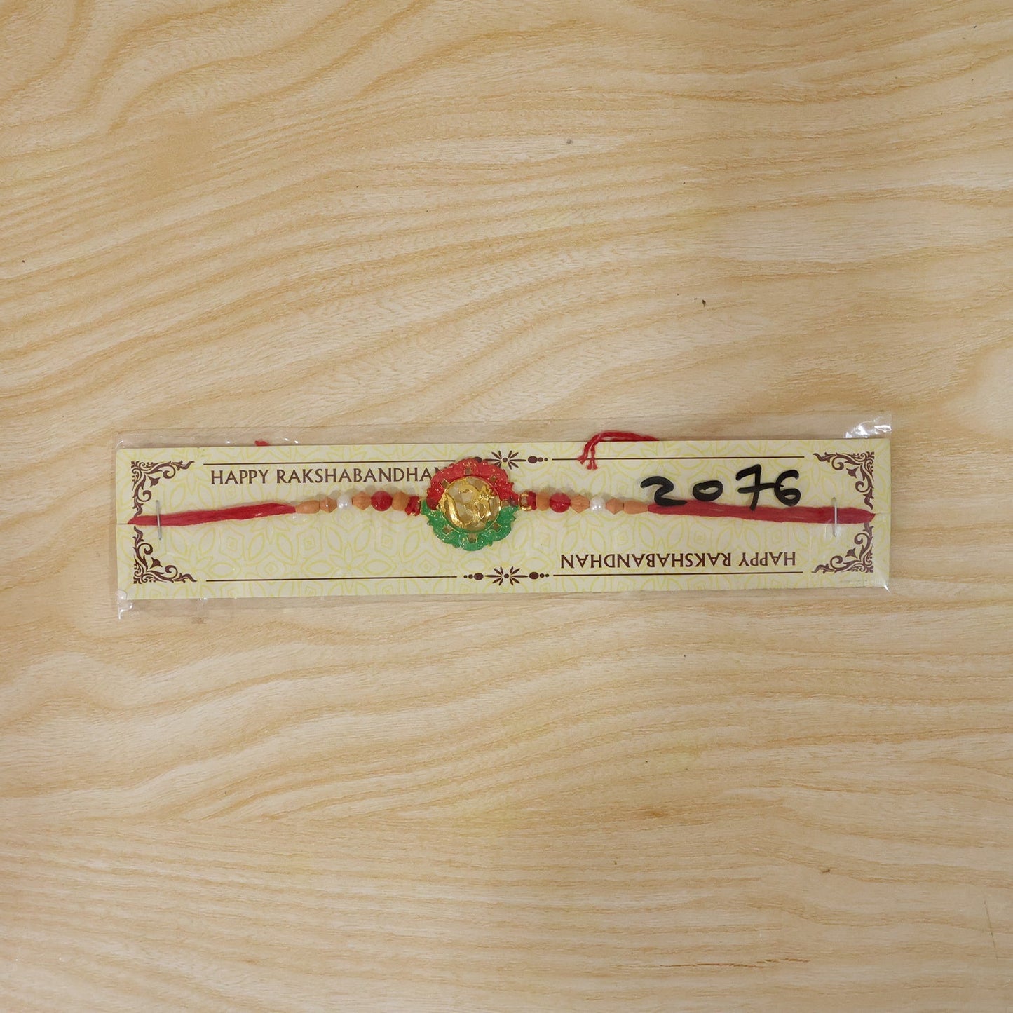 Beautiful traditional Om meenakari Rakhi for brother’s gift