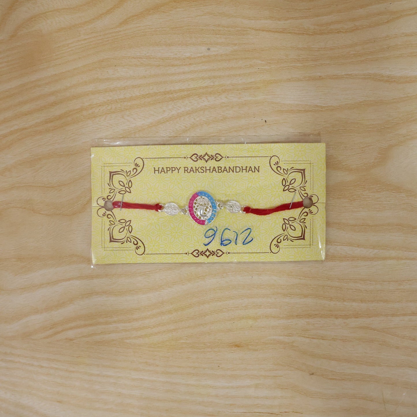 Festive Silver Rakhi with meenakari work, ideal for Raksha Bandhan celebrations