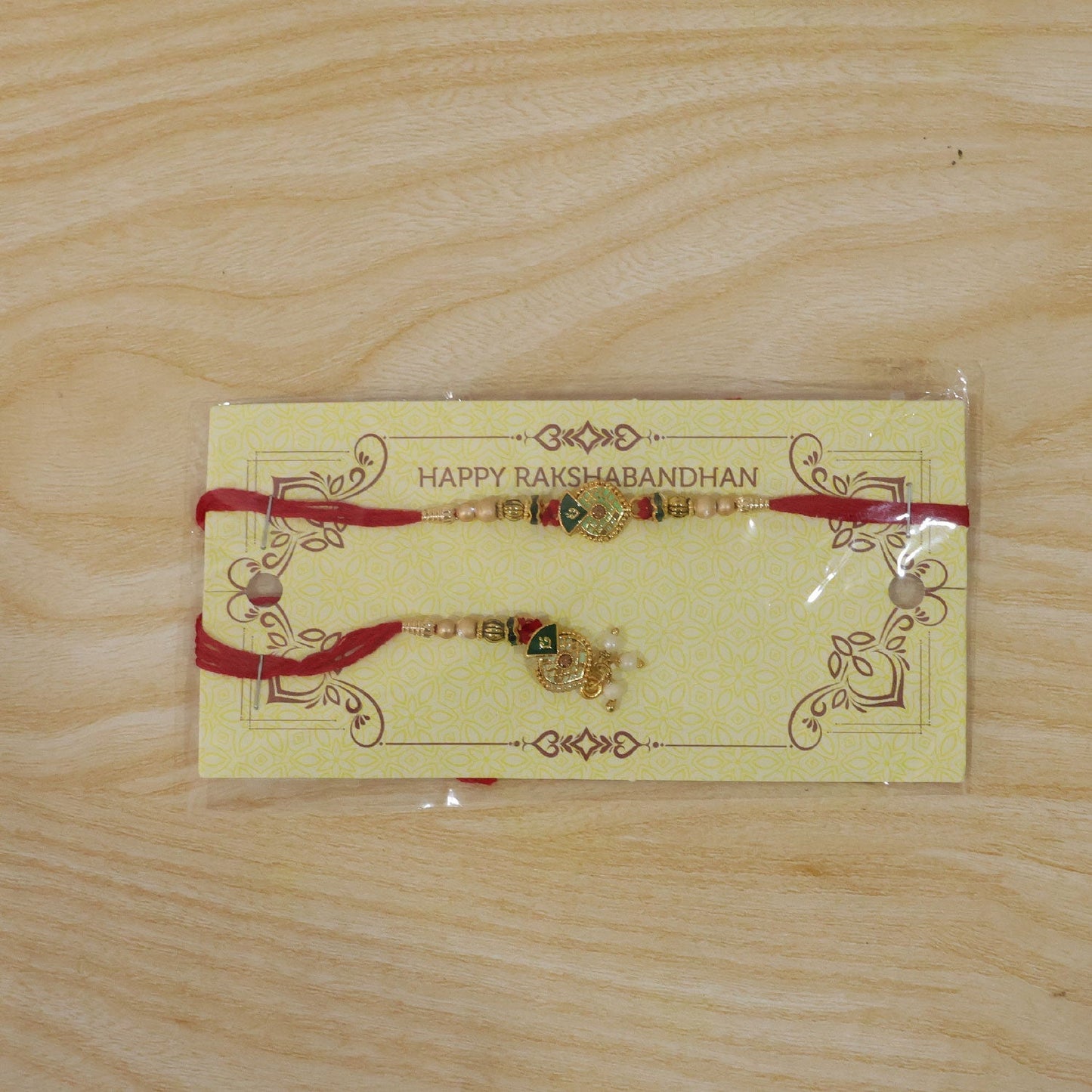 Festive green meenakari rakhi with pearl beads, perfect for Rakhi gifting