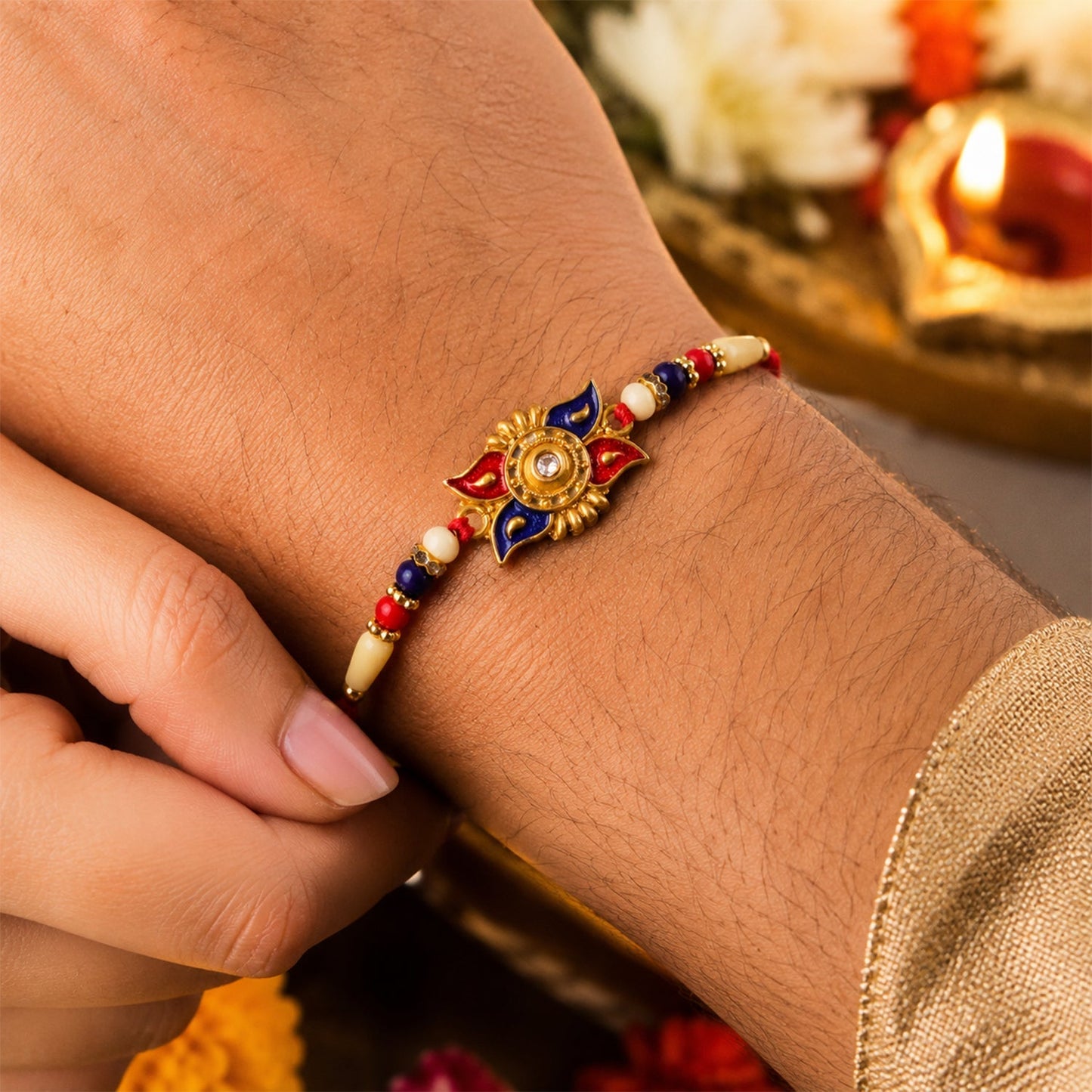 Side view of traditional kundan rakhi with pearl beads