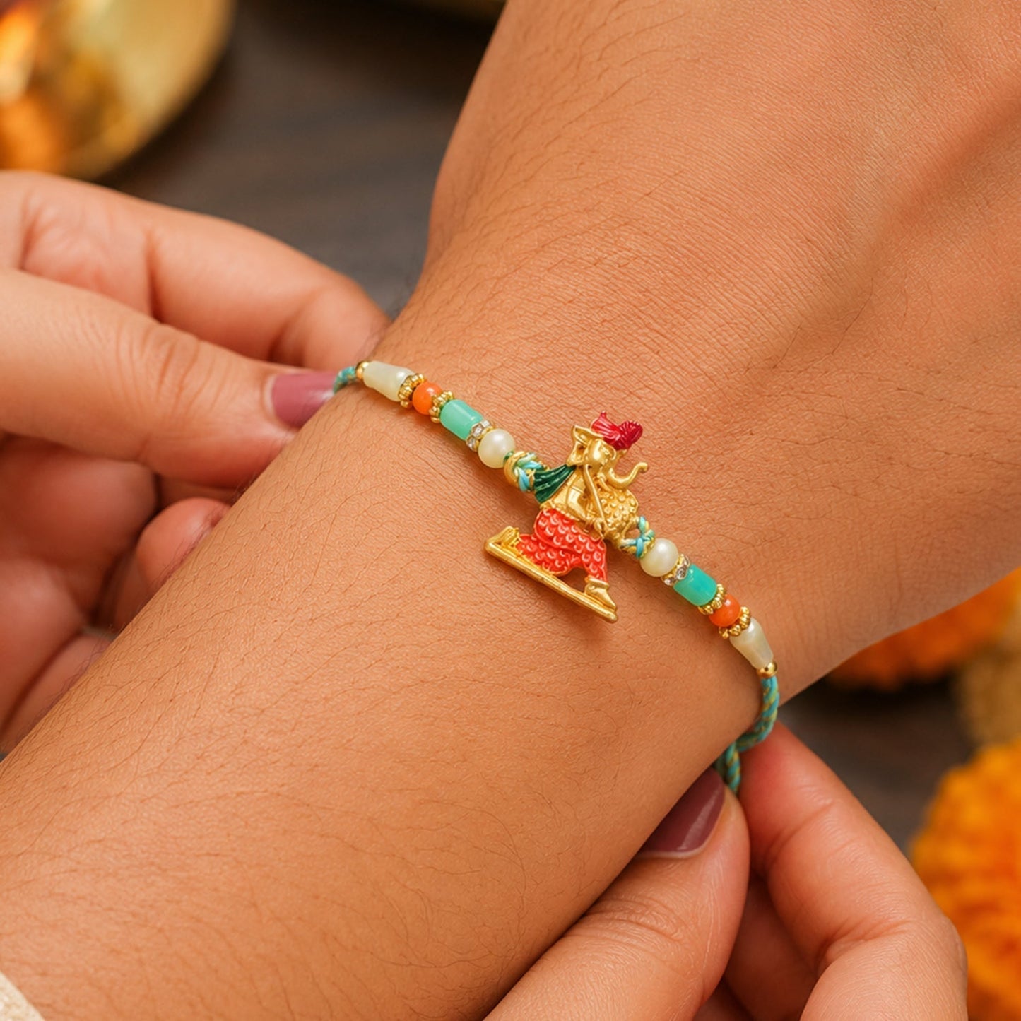 Close-up of decorative beads on Ganesh Charm Rakhi