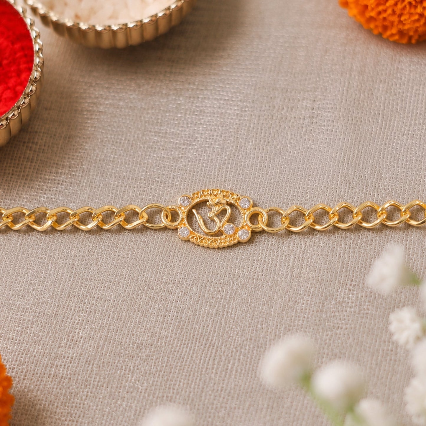 Elegant Om stone decorated rakhi bracelet from multiple angles
