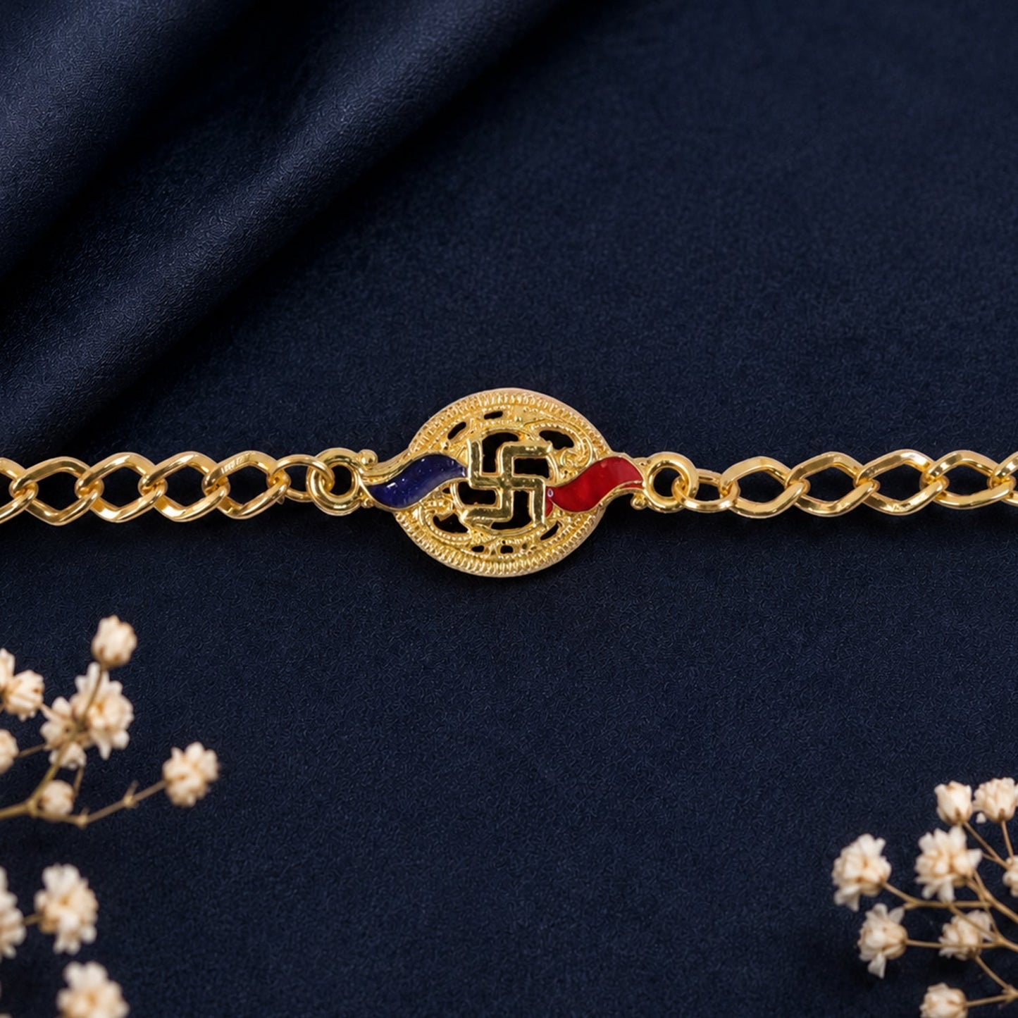 Detail of thread and beads on Swastik enamel rakhi