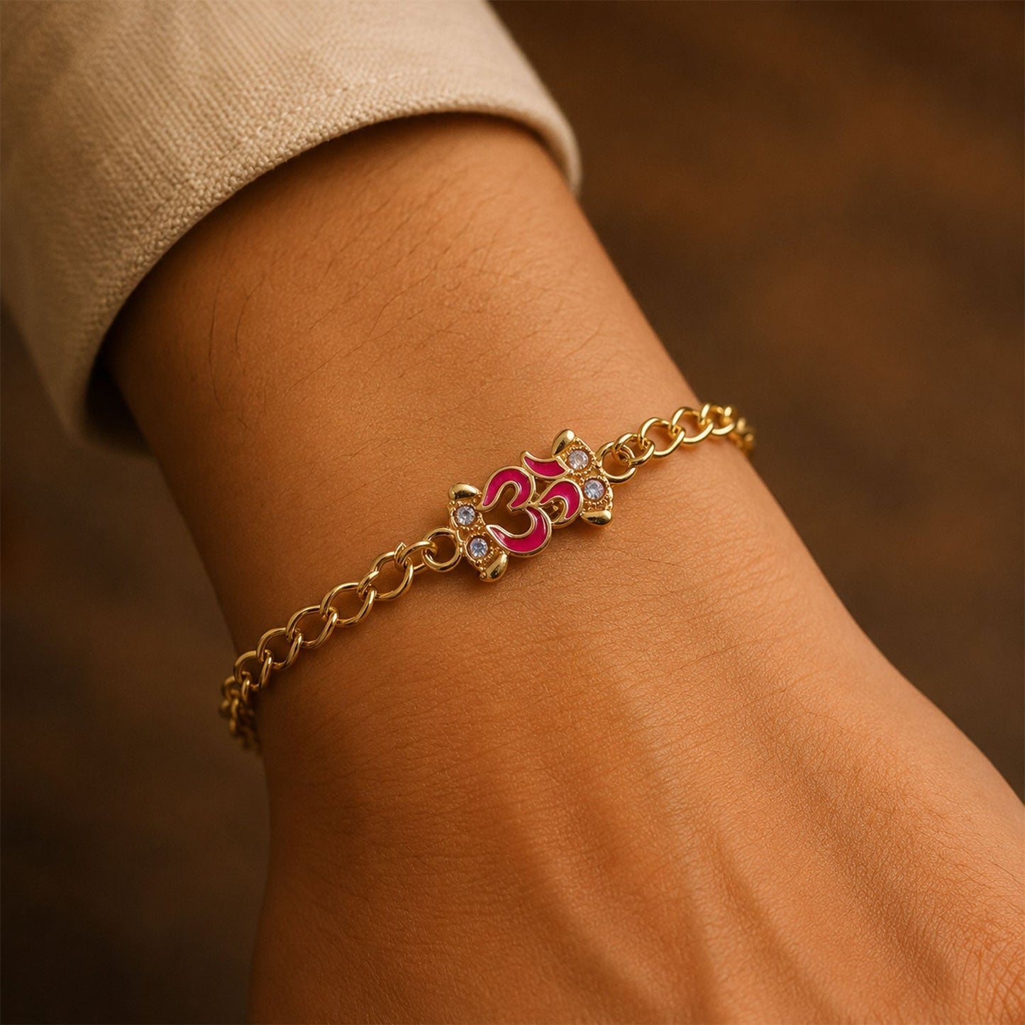 Stylish Om gold tone Rakhi bracelet with intricate design