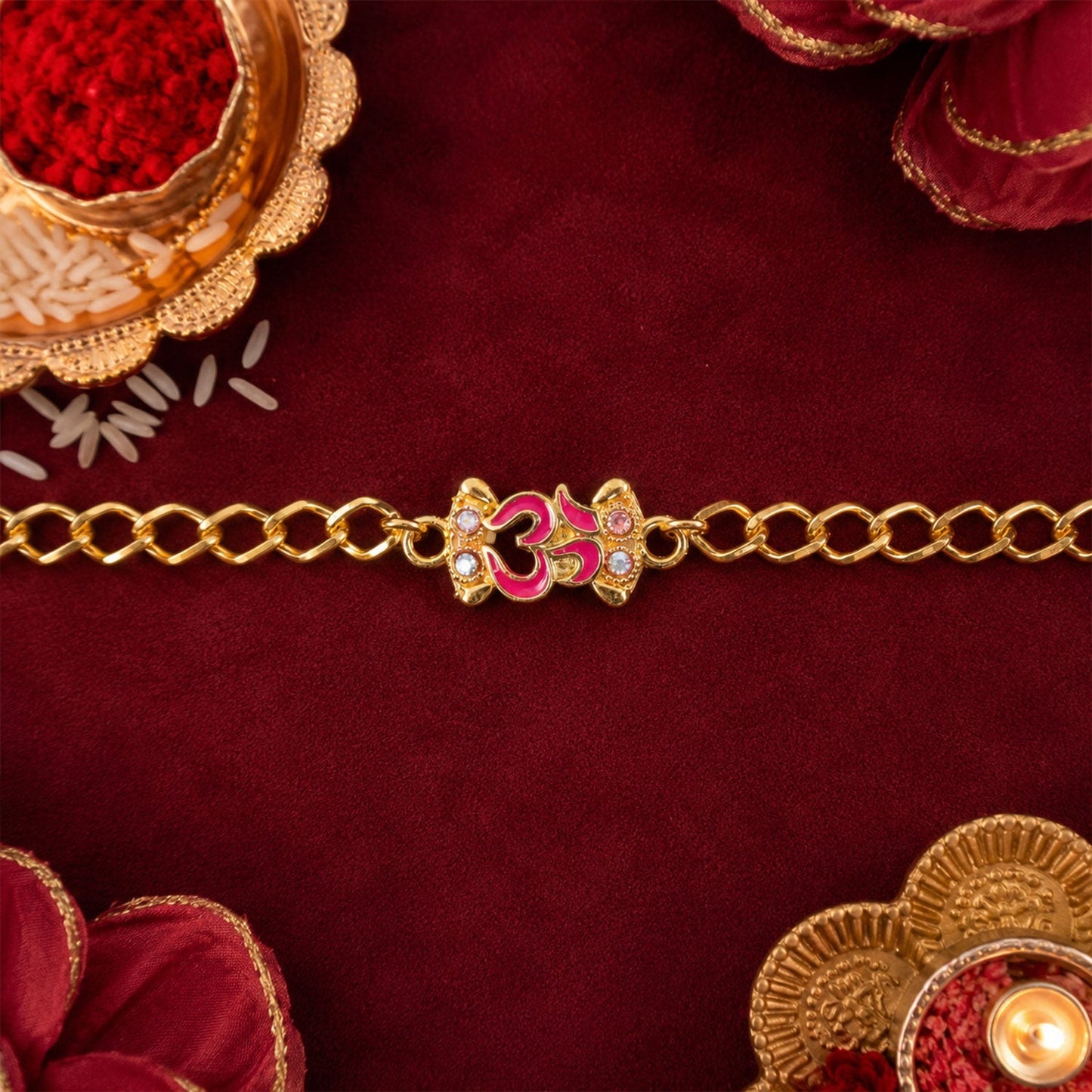 Festive Om Rakhi bracelet with decorative stones and traditional design