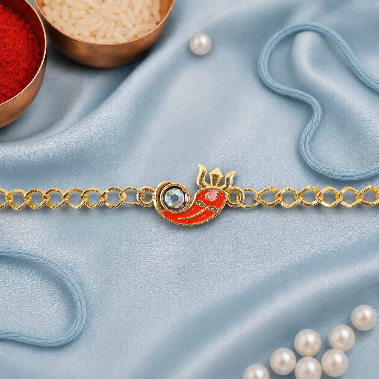 Ganesha rakhi bracelet laid flat showing detailed design