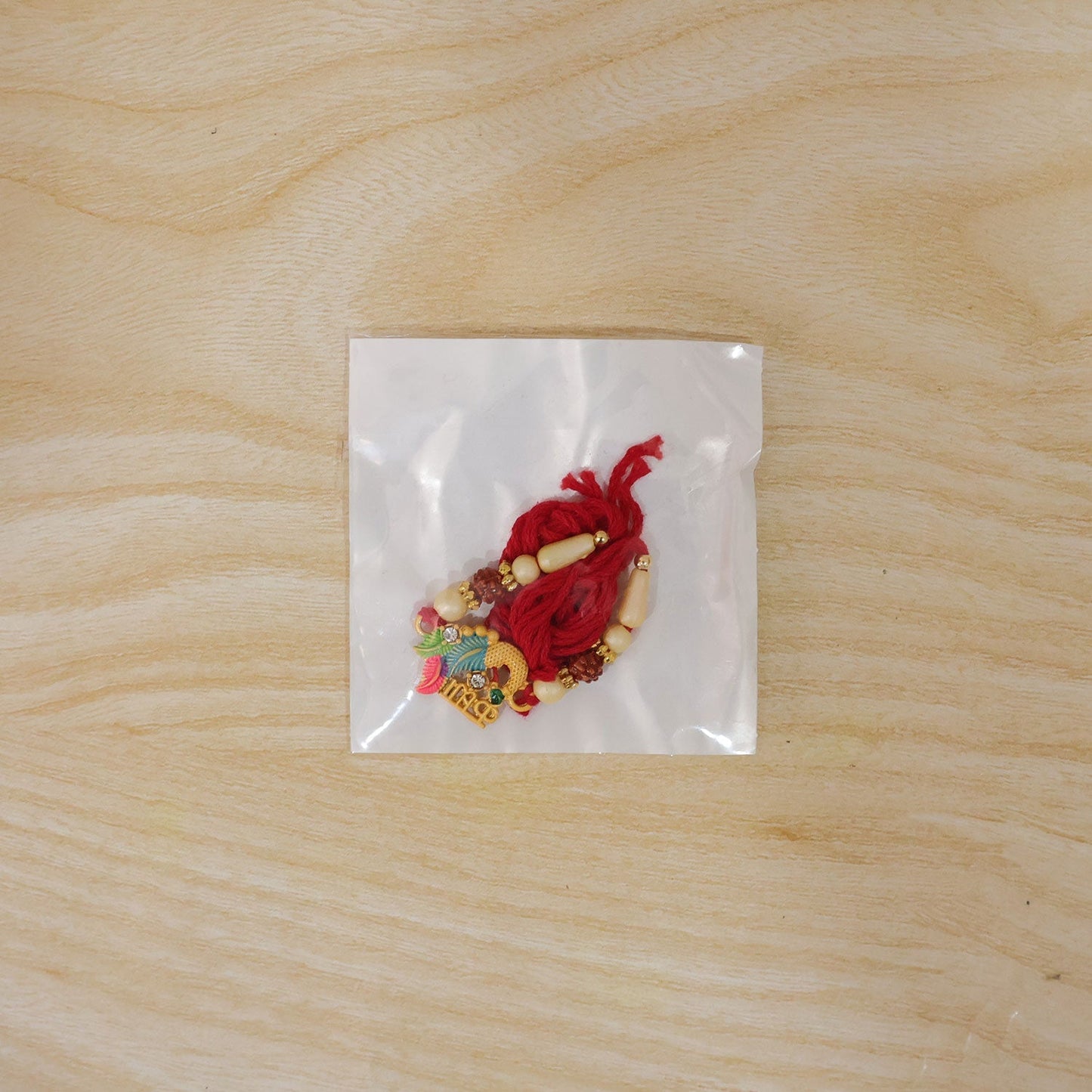 Festive Lord Ganesha Rakhi with vibrant colors and intricate design for Rakhsabandhan celebration