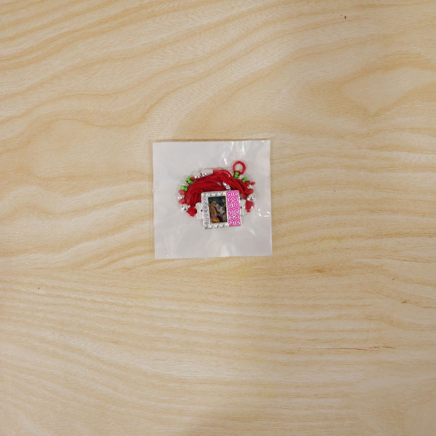 Elegant multicolor enamel Rakhi with photo frame for Raksha Bandhan celebrations