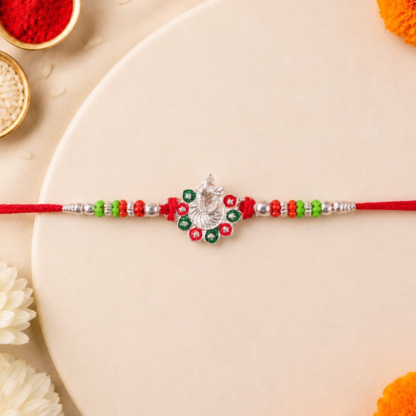 Beautiful silver-tone Rakhi with intricate stone design for Raksha Bandhan