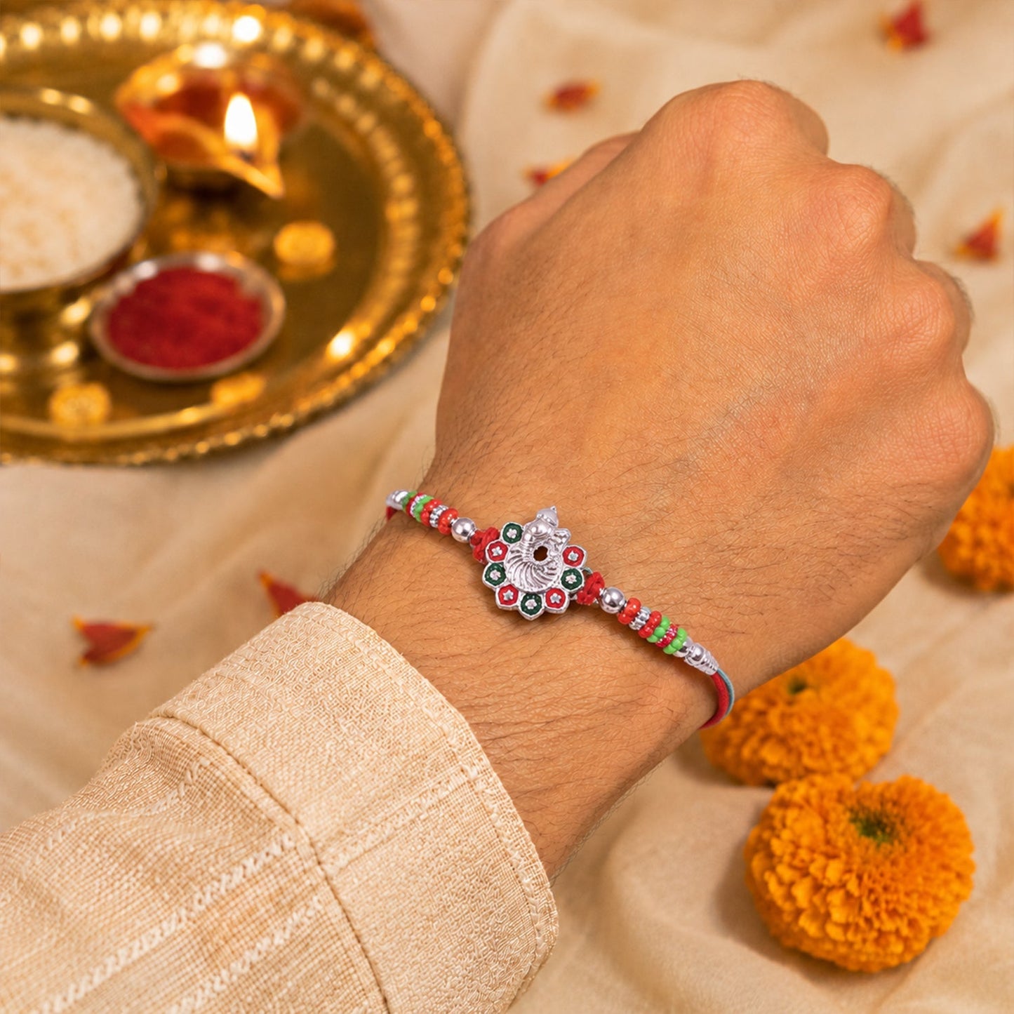 Elegant stone-studded Rakhi on a white background perfect for brother's gift
