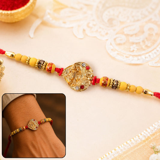 Premium Golden Tone Rakhi with intricate design and golden centerpiece