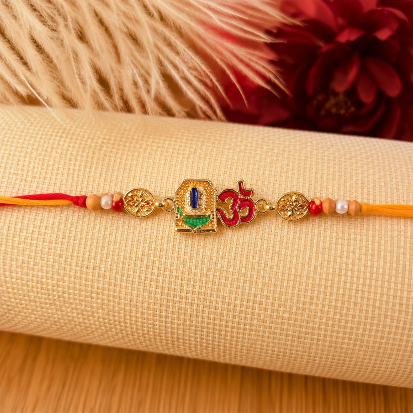 Close-up of Om Blue Enamel Rakhi showcasing intricate design