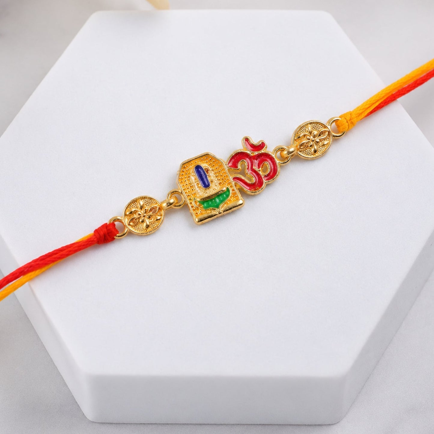 Festive Om Blue Enamel Rakhi jewelry with traditional motifs
