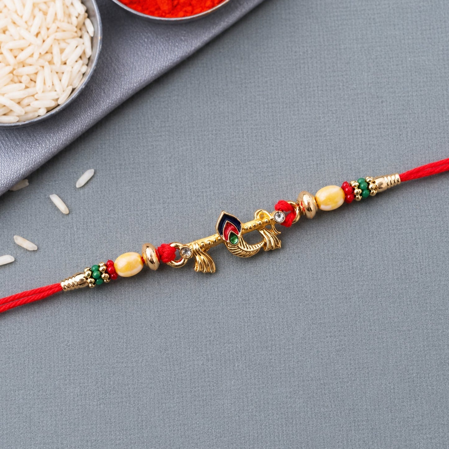 Vibrant Peacock Feather Rakhi displayed against light background
