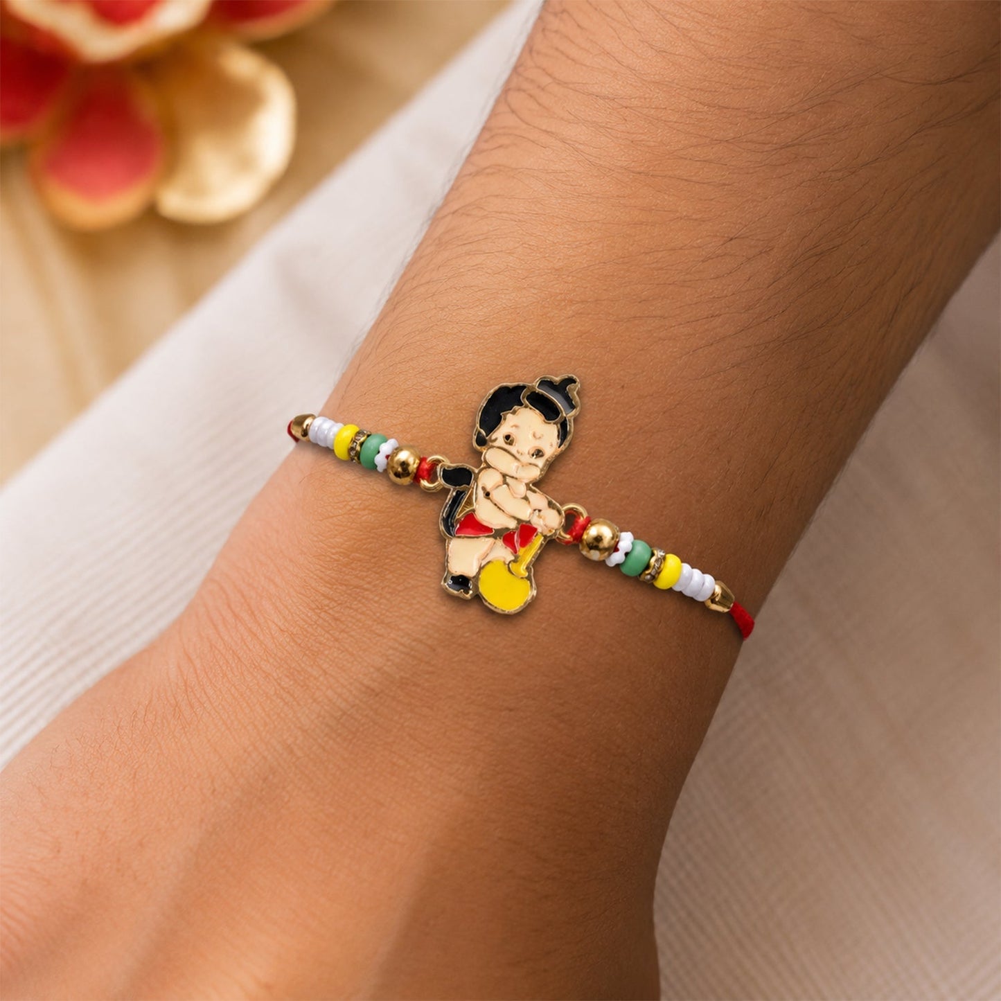 Beautiful multicolor bead Rakhi with traditional design for brothers