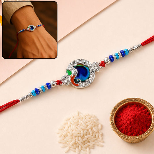 Elegant Peacock Blue Stone Rakhi with silver-tone thread, perfect for Raksha Bandhan celebrations.