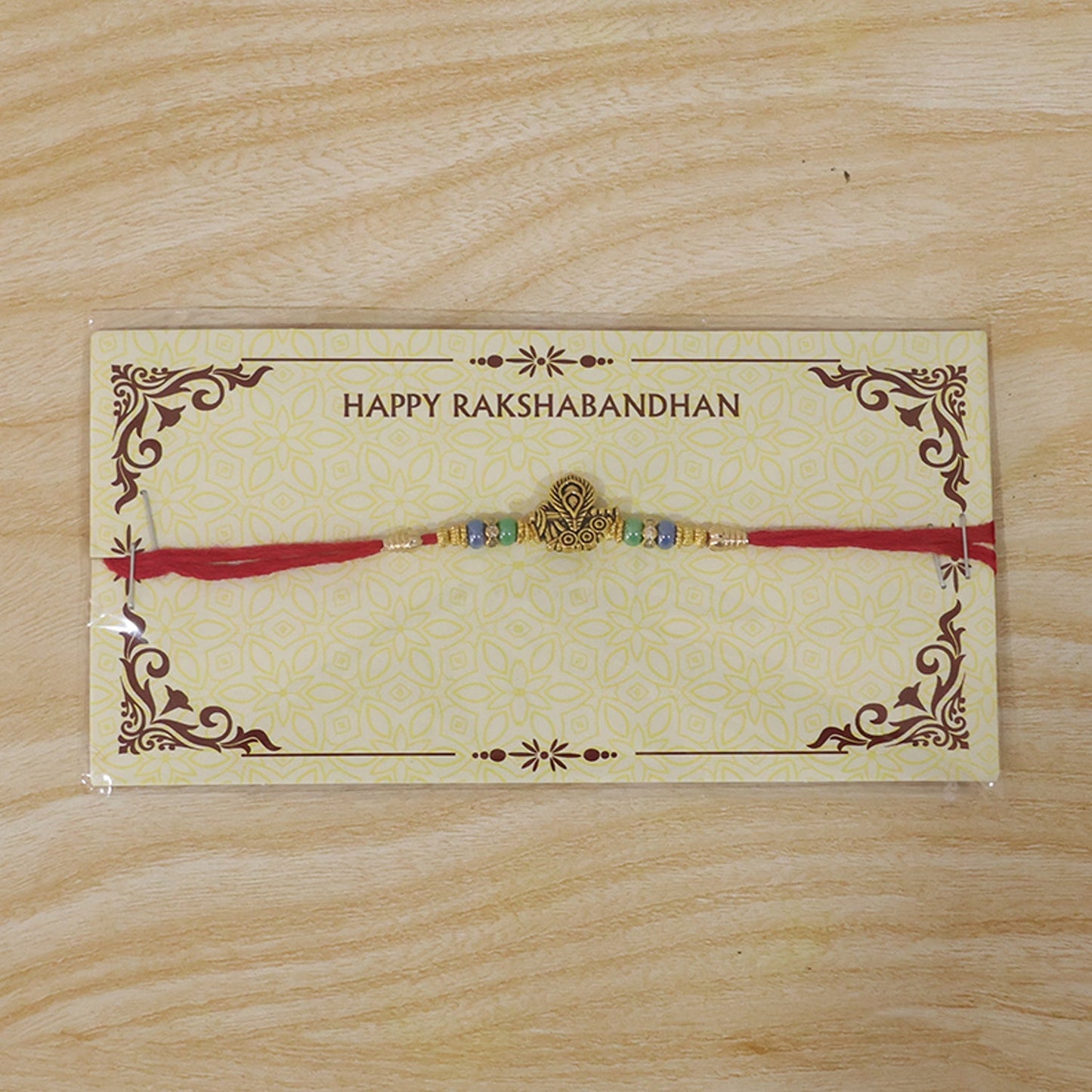 Intricate antique peacock motif on traditional rakhi for brothers