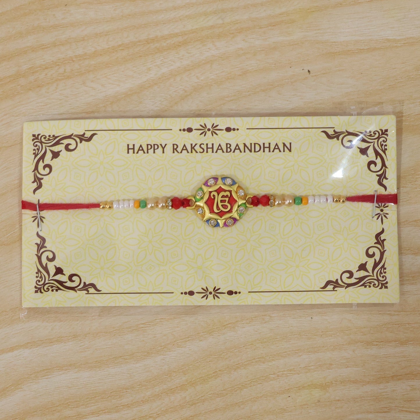Diagonal view of colorful meenakari rakhi for Raksha Bandhan