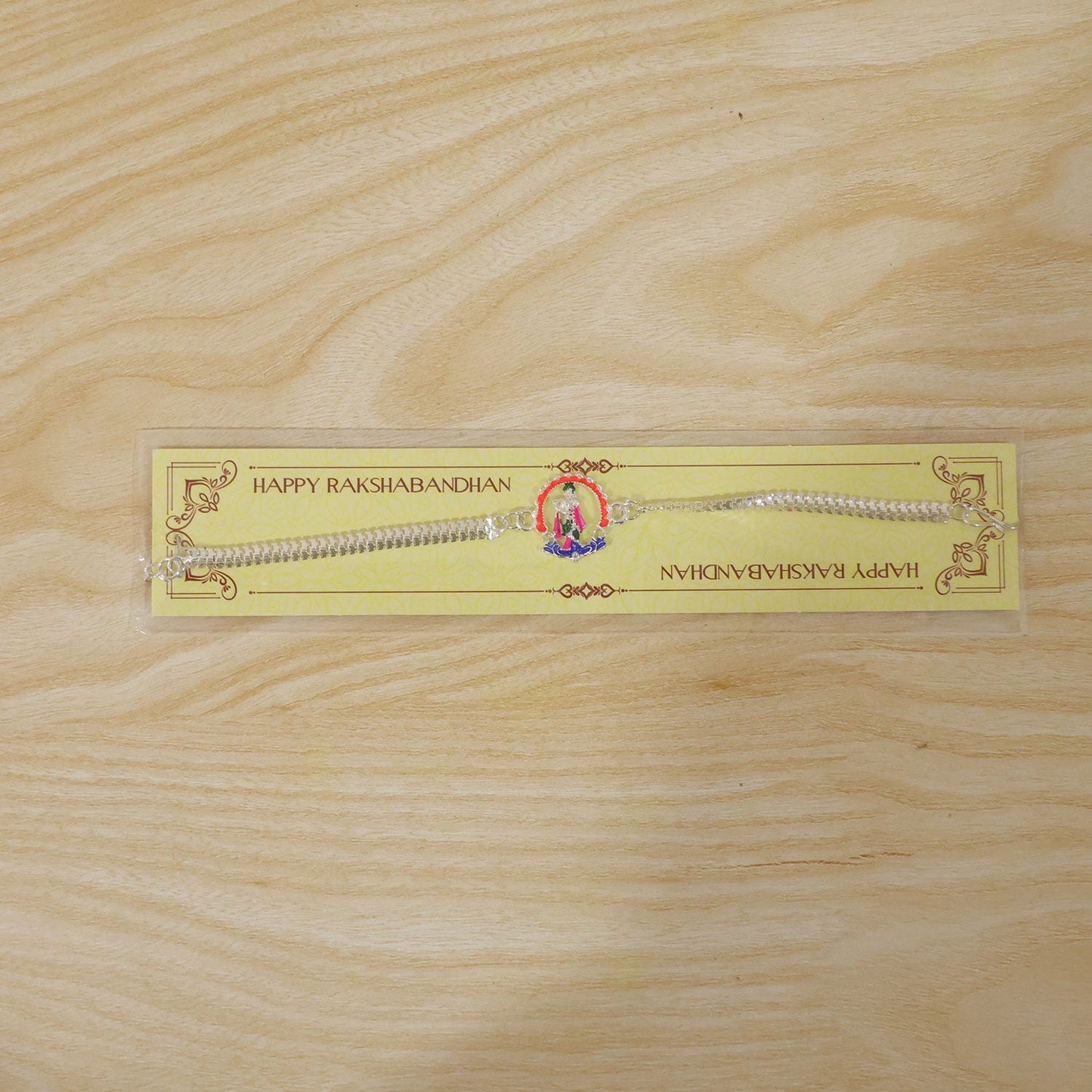 Angled shot of Silver Krishna Rakhi showcasing craftsmanship