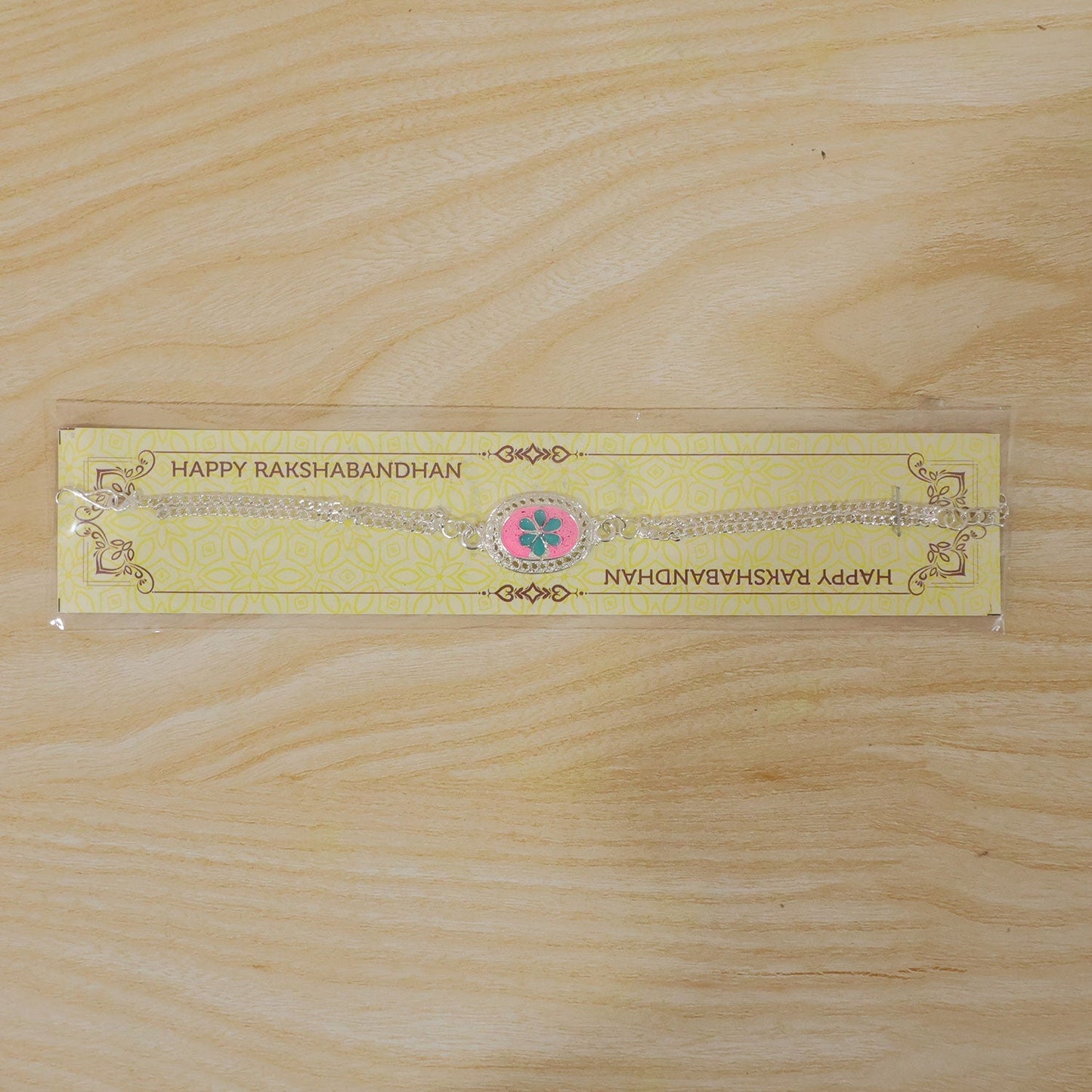 Stylish Silver floral Rakhi with detailed craftsmanship