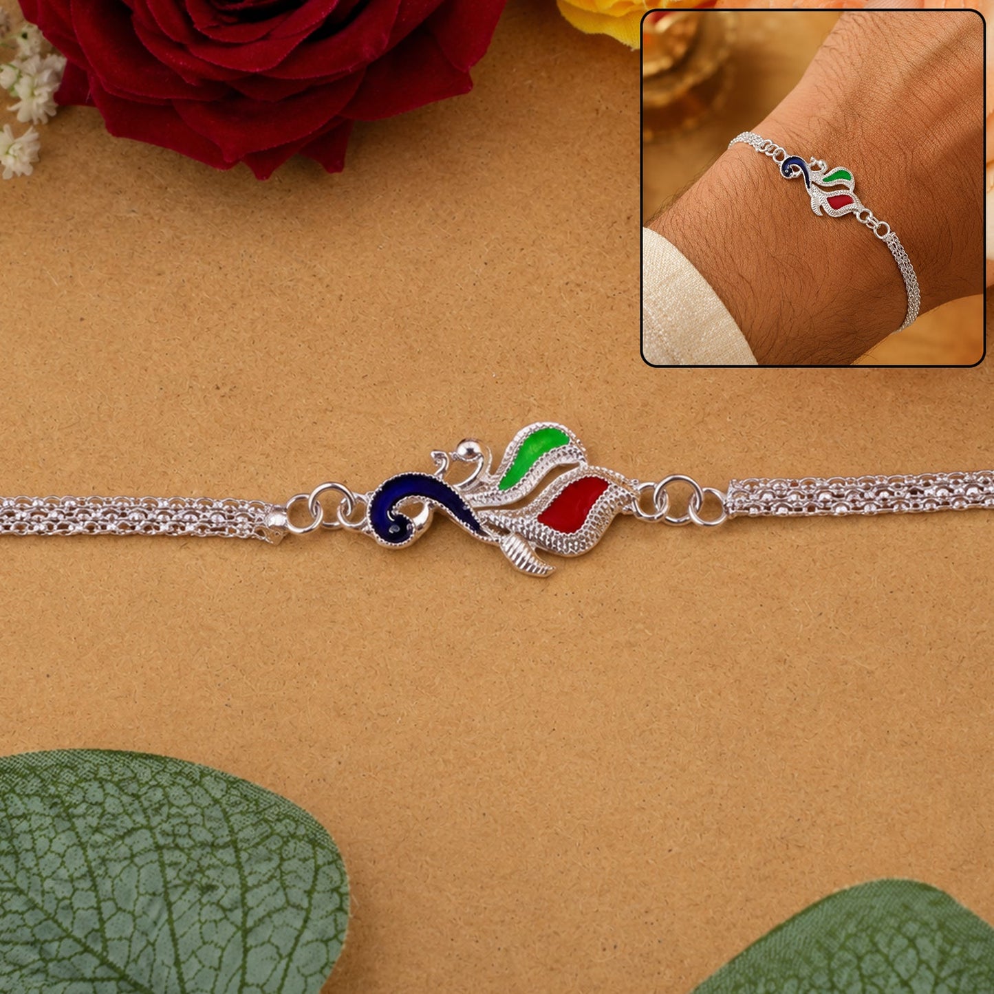 Close-up of Silver Peacock enamel design on festive Rakhi for brothers