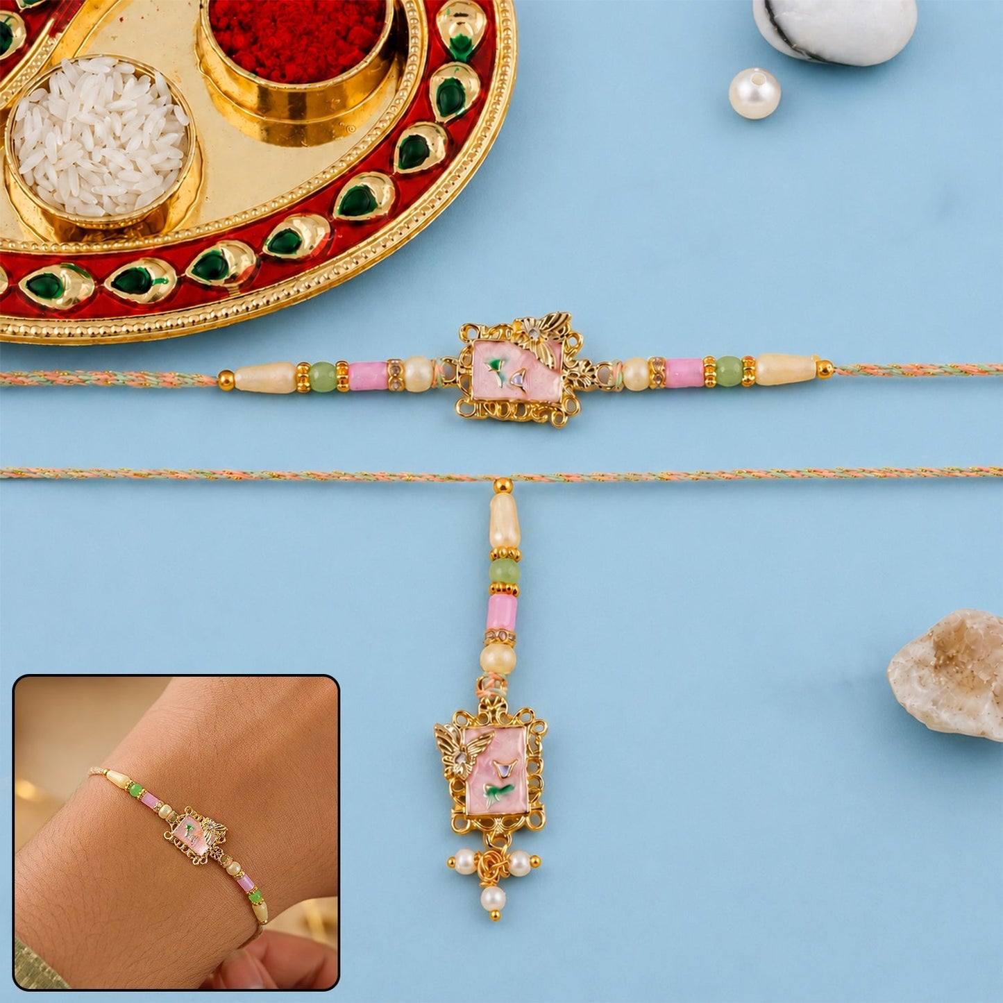 Close-up of pink floral design with kundan and pearls on traditional Rakhi.