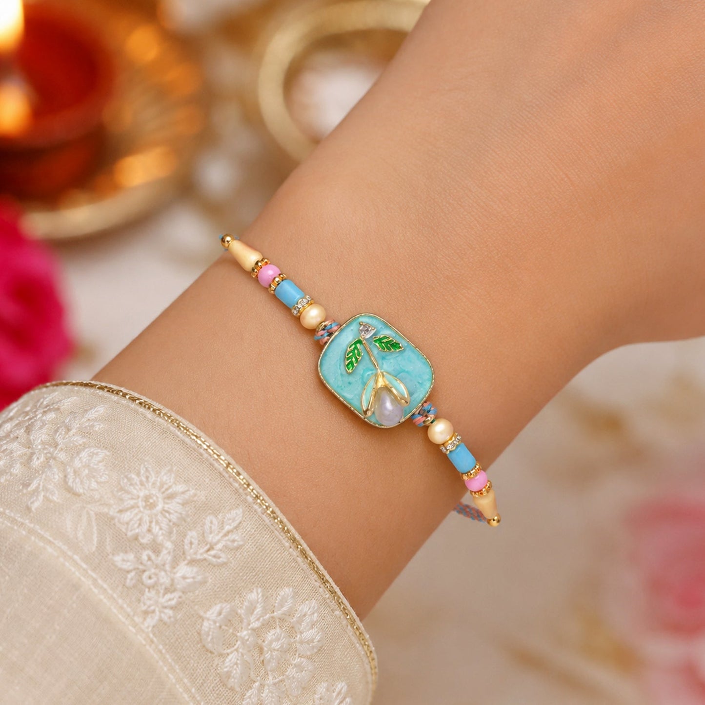Close-up of Teal Stone Pearl Rakhi for Bhaiya Bhabhi celebration