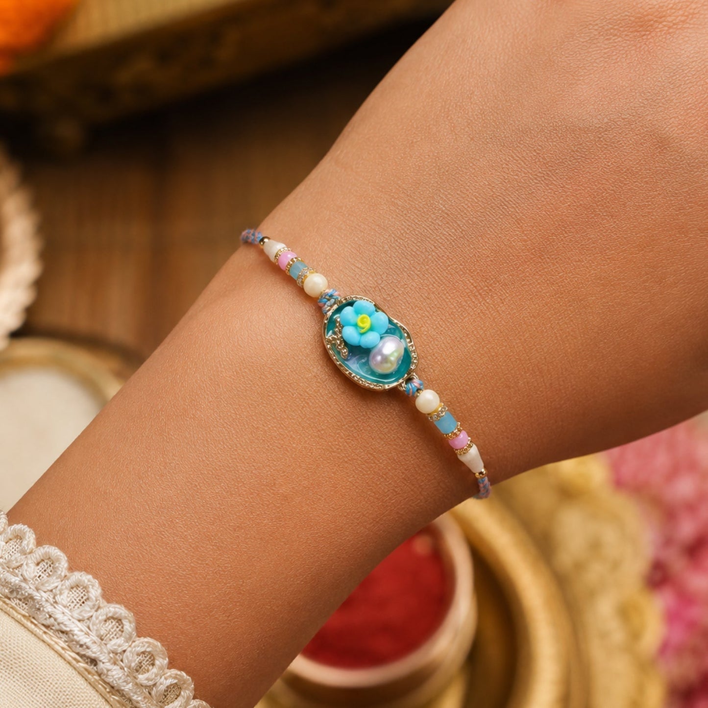 Elegant traditional Lumba Rakhi with floral design for sister to wear