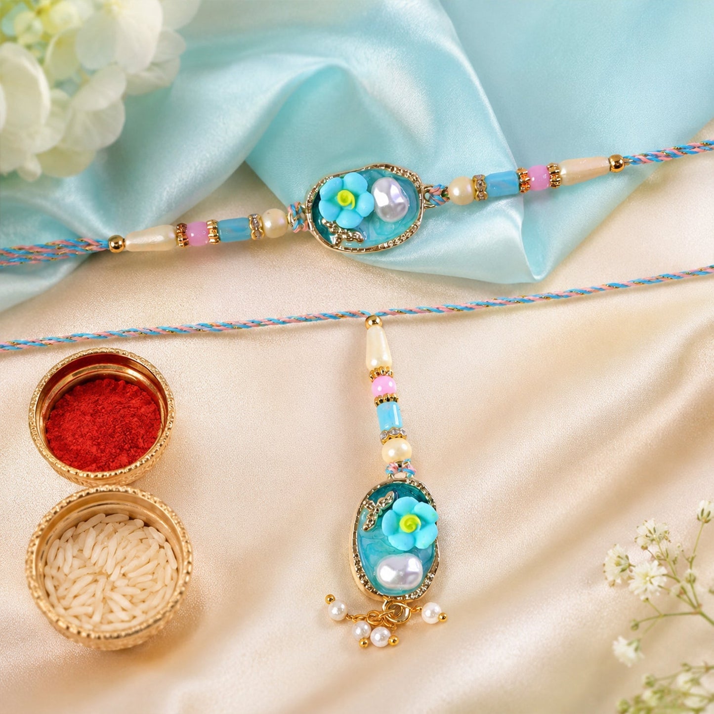 Close-up of handcrafted Aqua Floral Pearl Lumba Rakhi with intricate detailing
