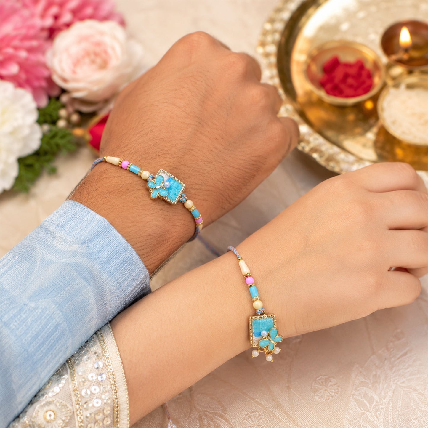 Decorative turquoise floral Bhaiya Bhabhi Lumba Rakhi on display