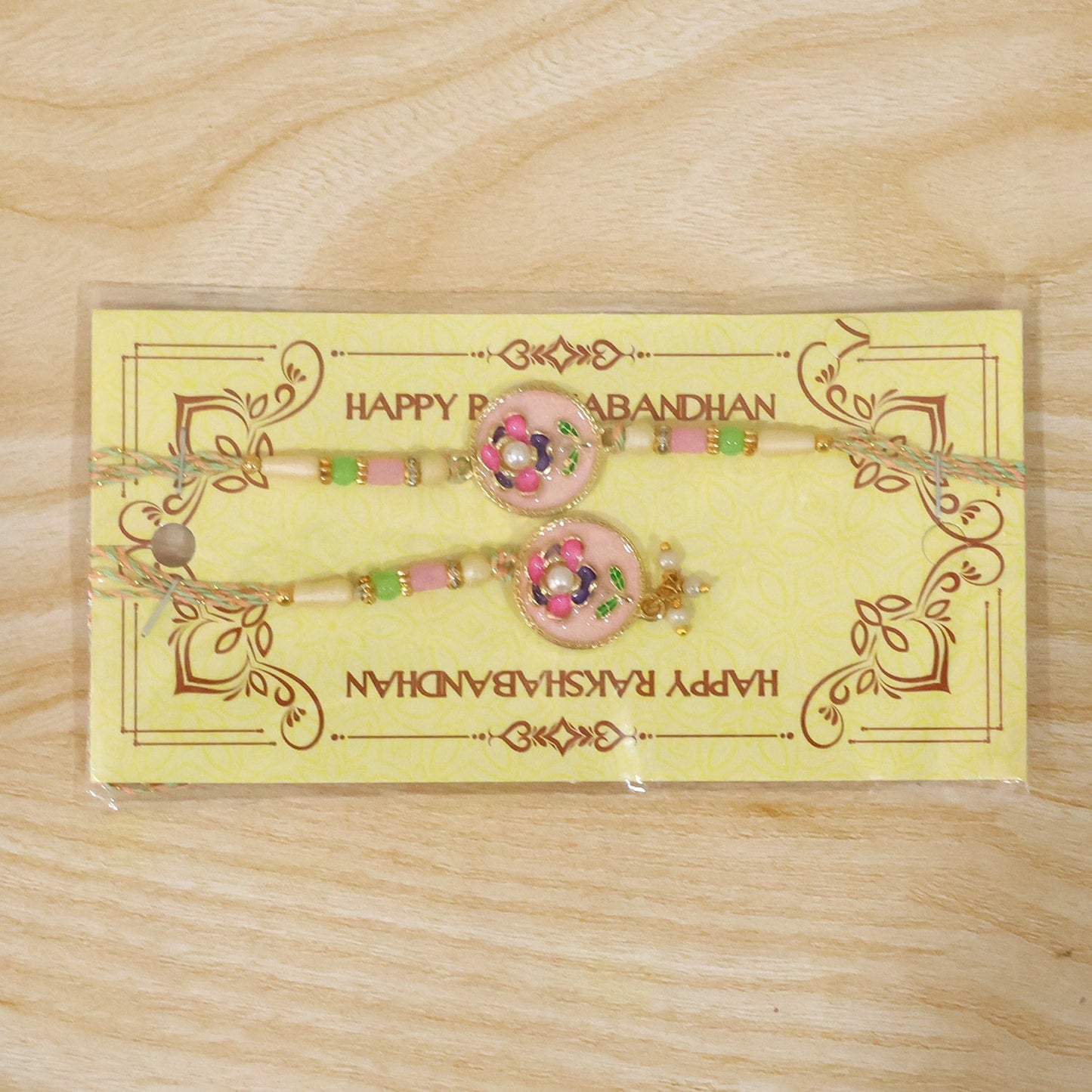 Exquisite pink floral Bhabhi Lumba Rakhi for festival celebrations