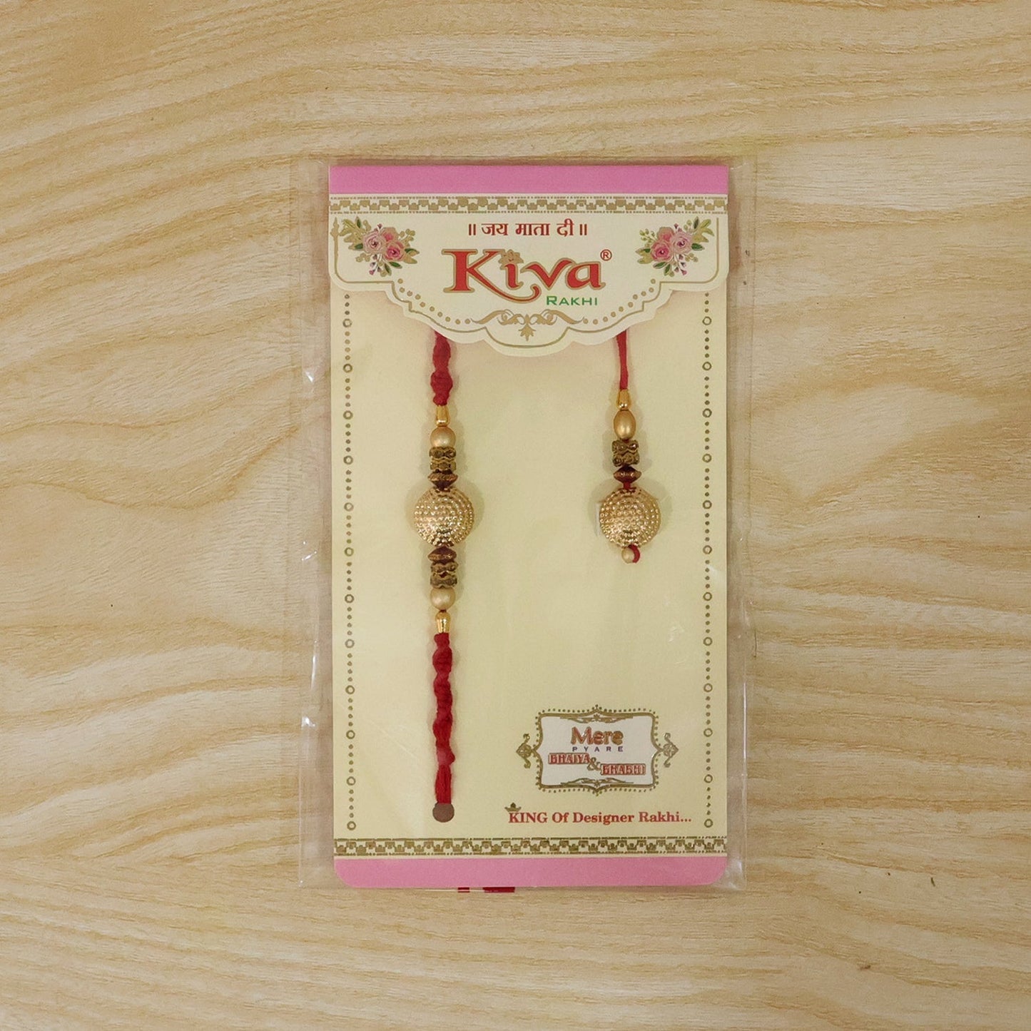 Both rakhis with delicate threads and golden pearls shown together.