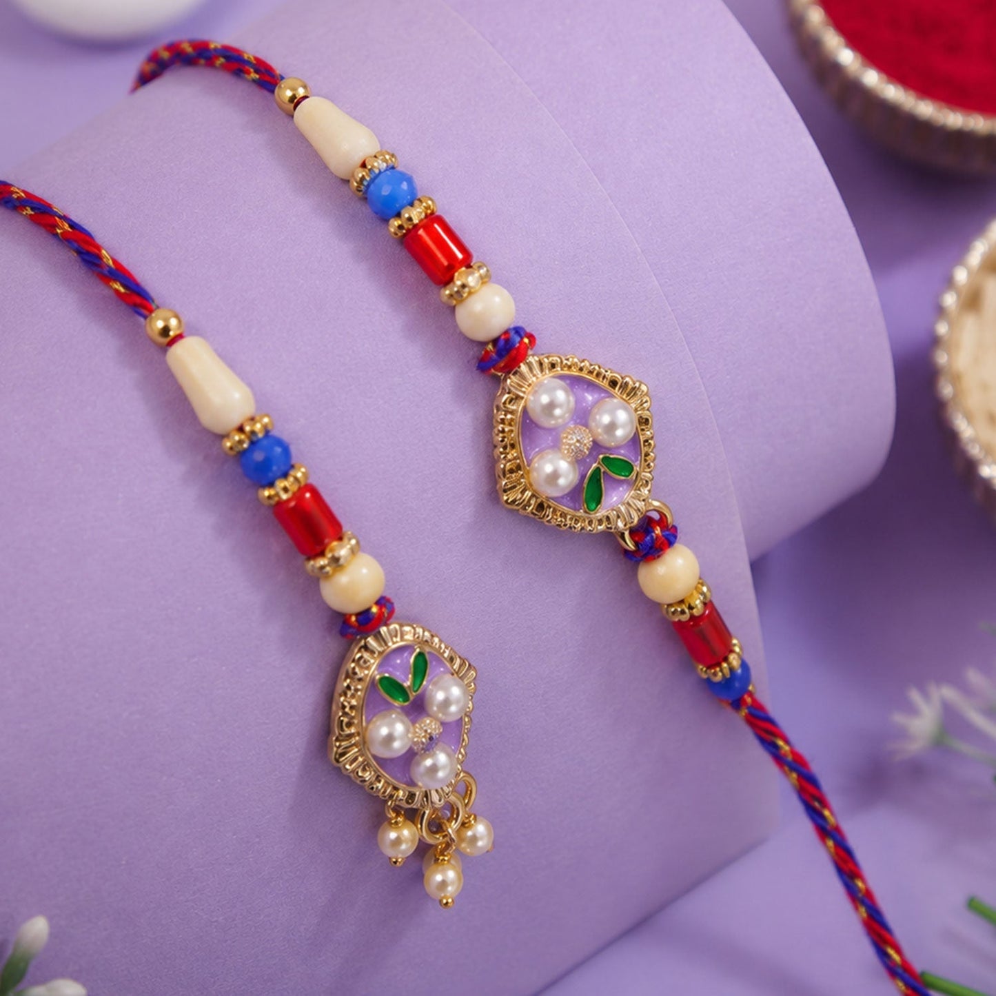 Beautifully crafted pearl and enamel rakhi for brothers