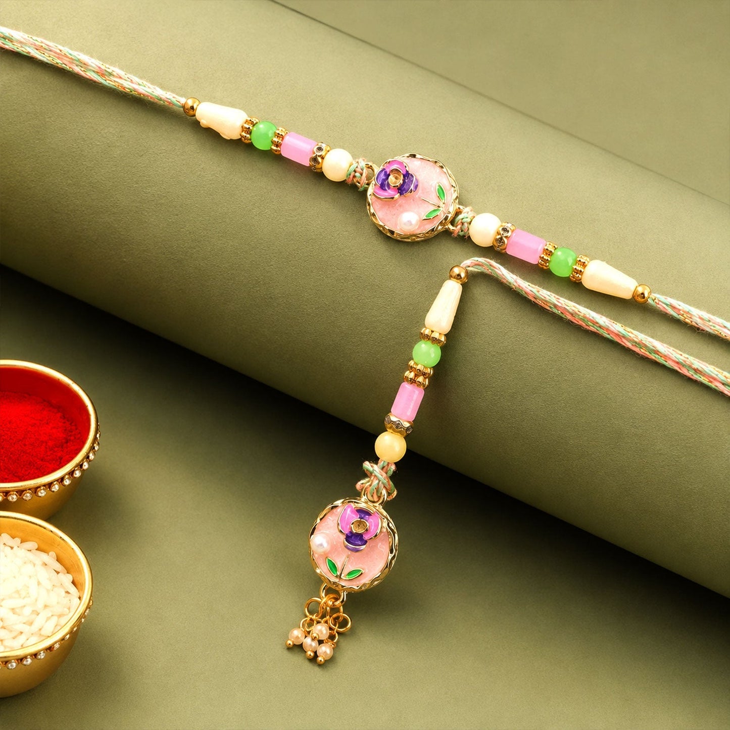 Enamel floral round charm with pearl beads on Rakhi for Rakshabandhan