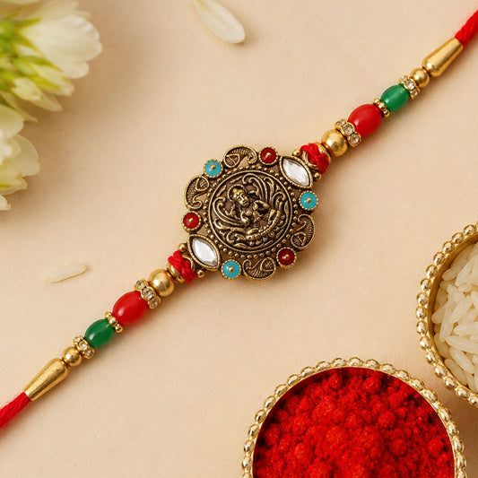 Elegant antique golden rakhi with kundan stones and colorful beads, perfect for Rakshabandhan celebrations.