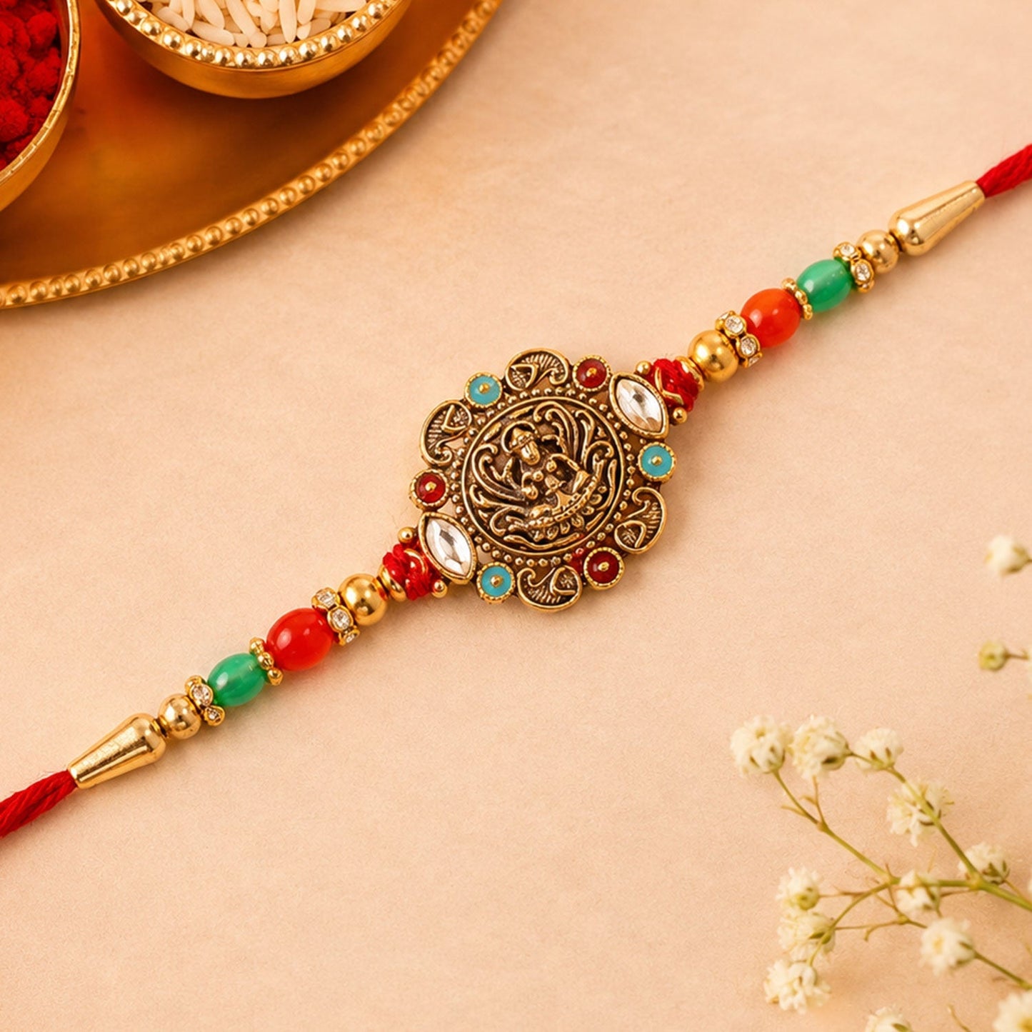 Close-up of beautifully crafted traditional rakhi with divine kundan stones and beads.