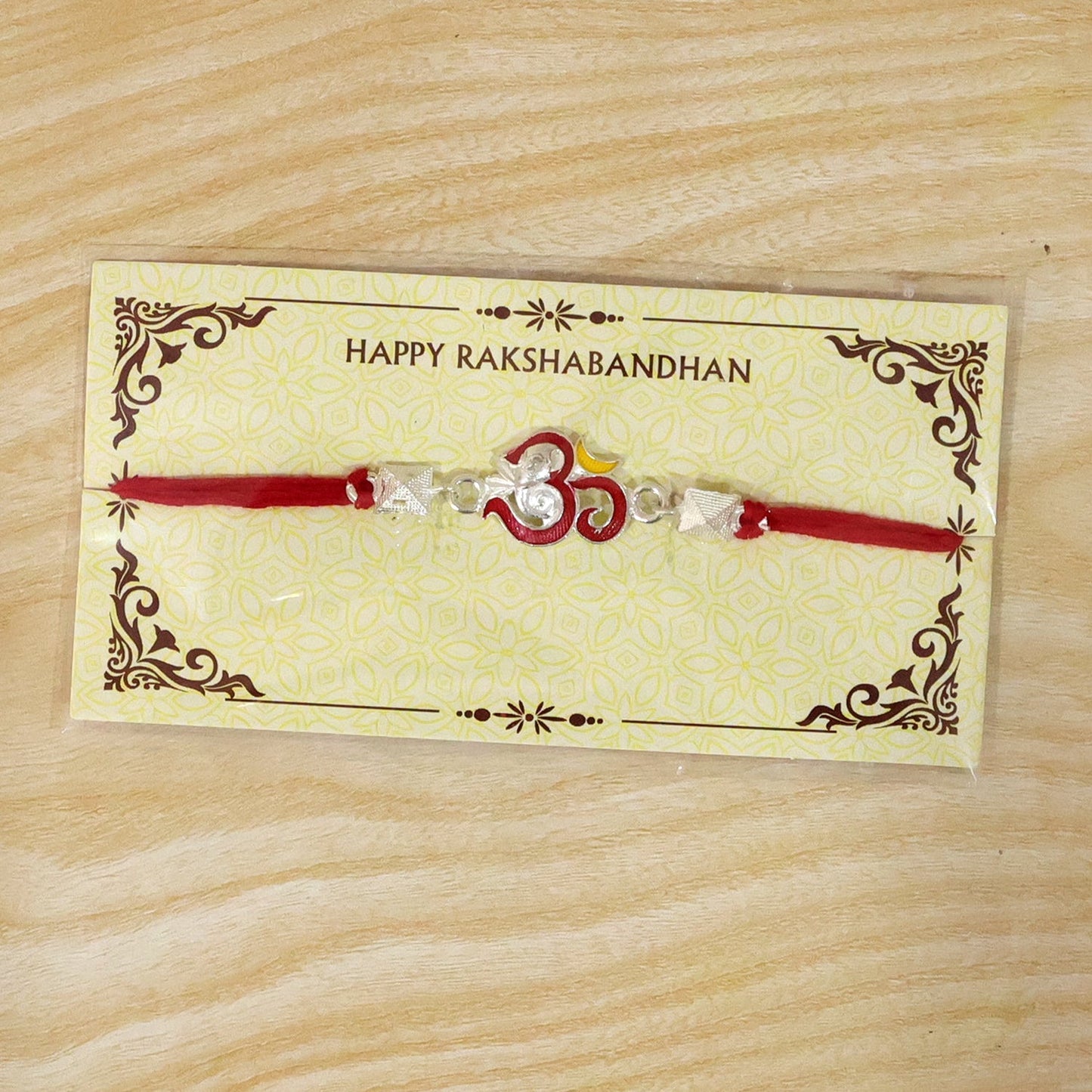 Beautifully crafted silver Ganesha Rakhi with bright enamel for Raksha Bandhan celebration