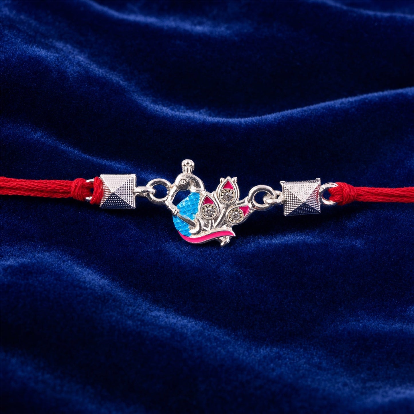 Beautiful silver peacock Rakhi with intricate enamel bead work