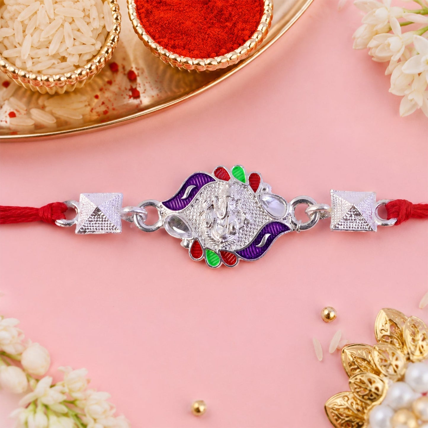 Decorative Silver Ganesha Rakhi for brother on festive occasion